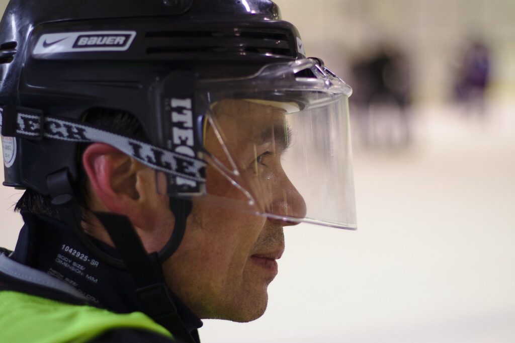 hockey player wearing helmet